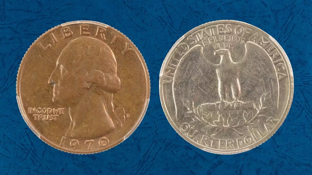 1970-D quarter missing clad layer showing copper-colored exposed core on one side compared to normal silver-gray clad surface